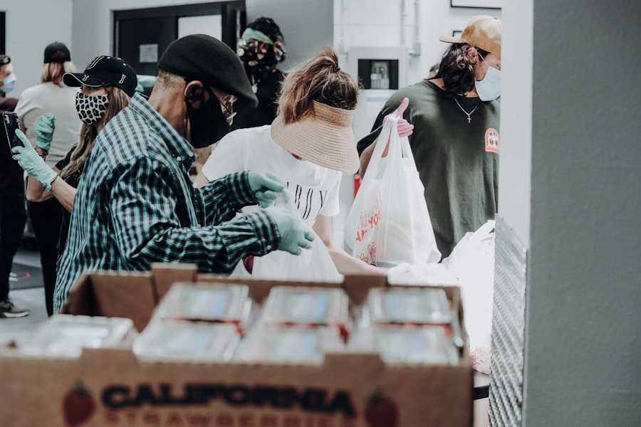 Volunteers sorting donated food and supplies into boxes